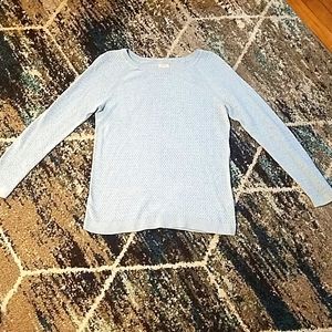 A light blue sweater